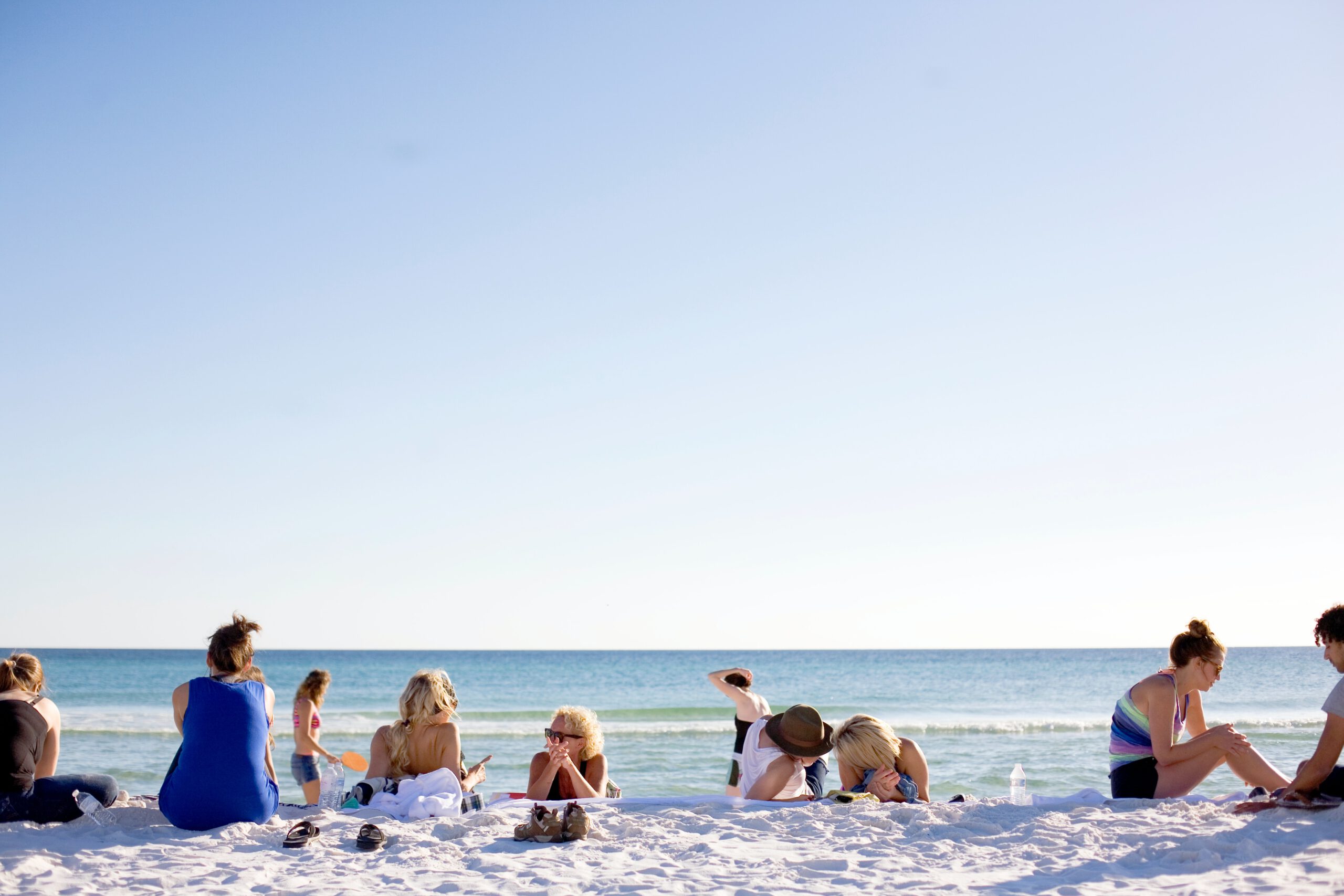 people on white sand beach