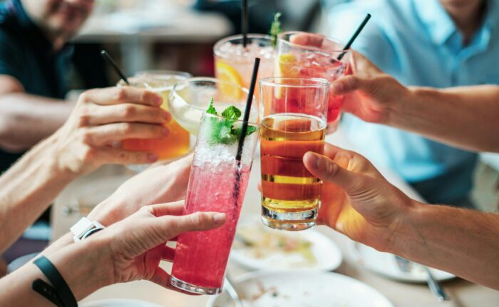 a group toasting their drinks at a restaurant