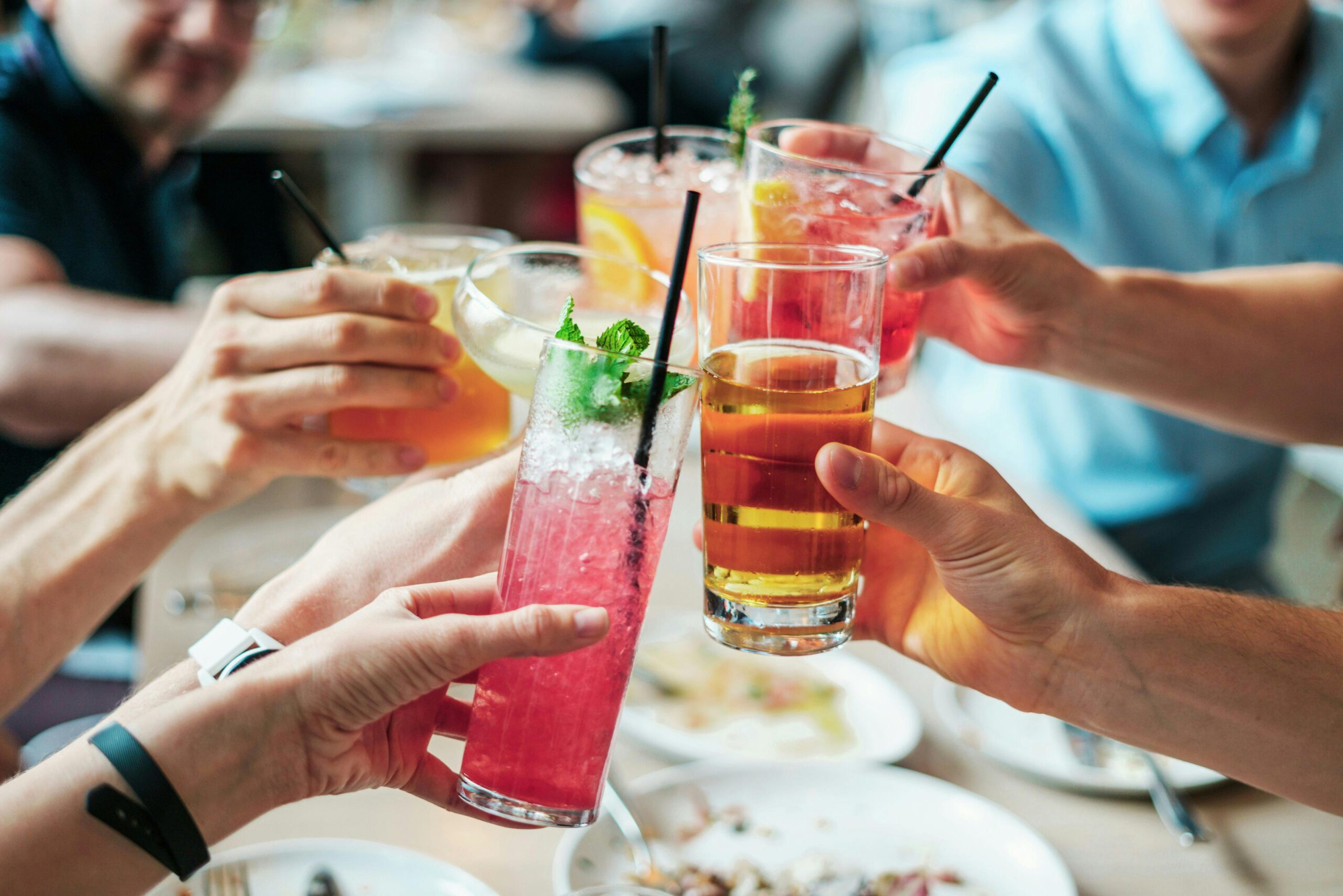 a group toasting their drinks at a restaurant