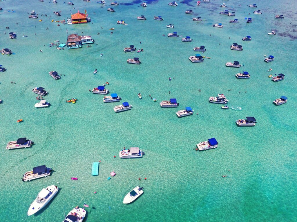 aerial view of boats at crab island during the day time