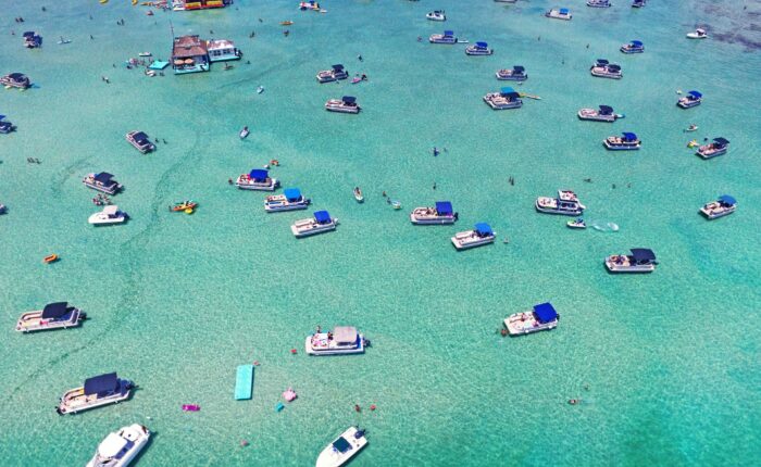 aerial view of boats at crab island during the day time