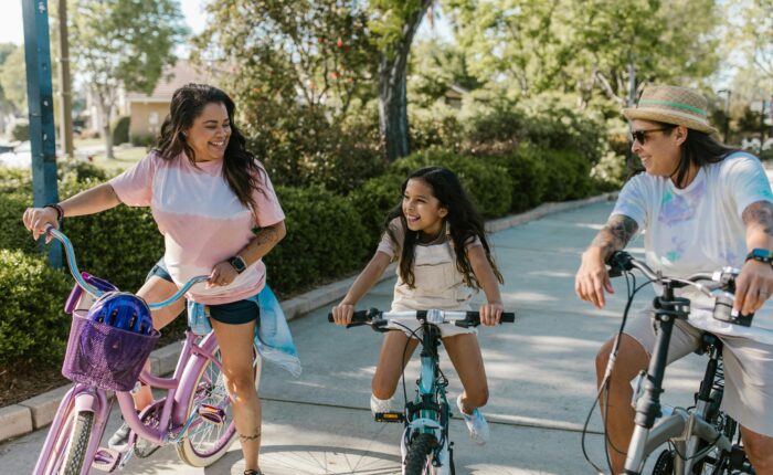 three people on bikes