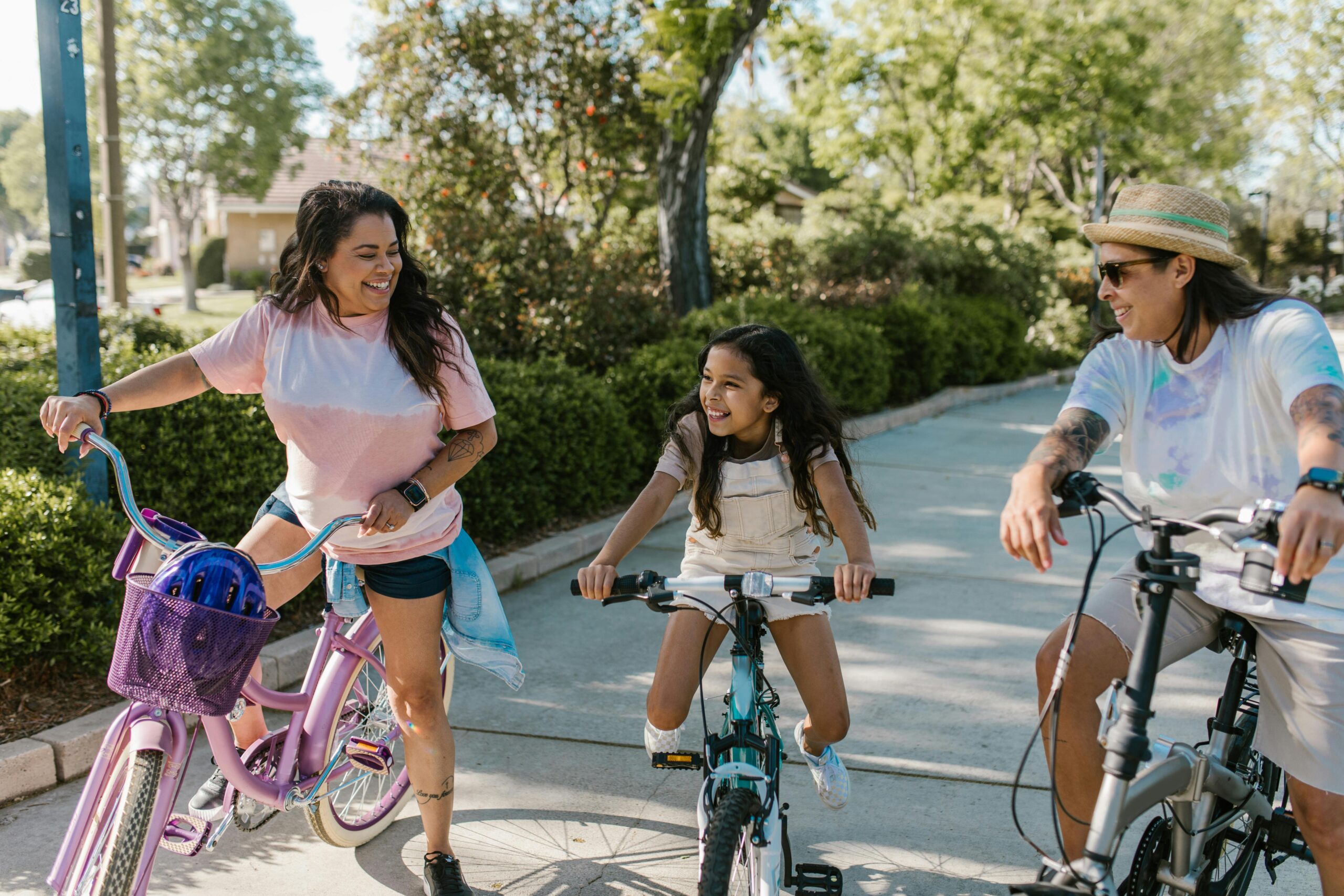 three people on bikes