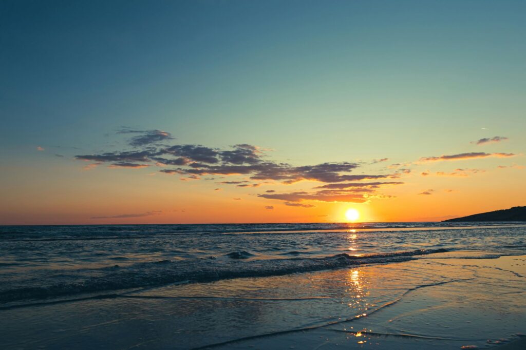 a sunset over a beach